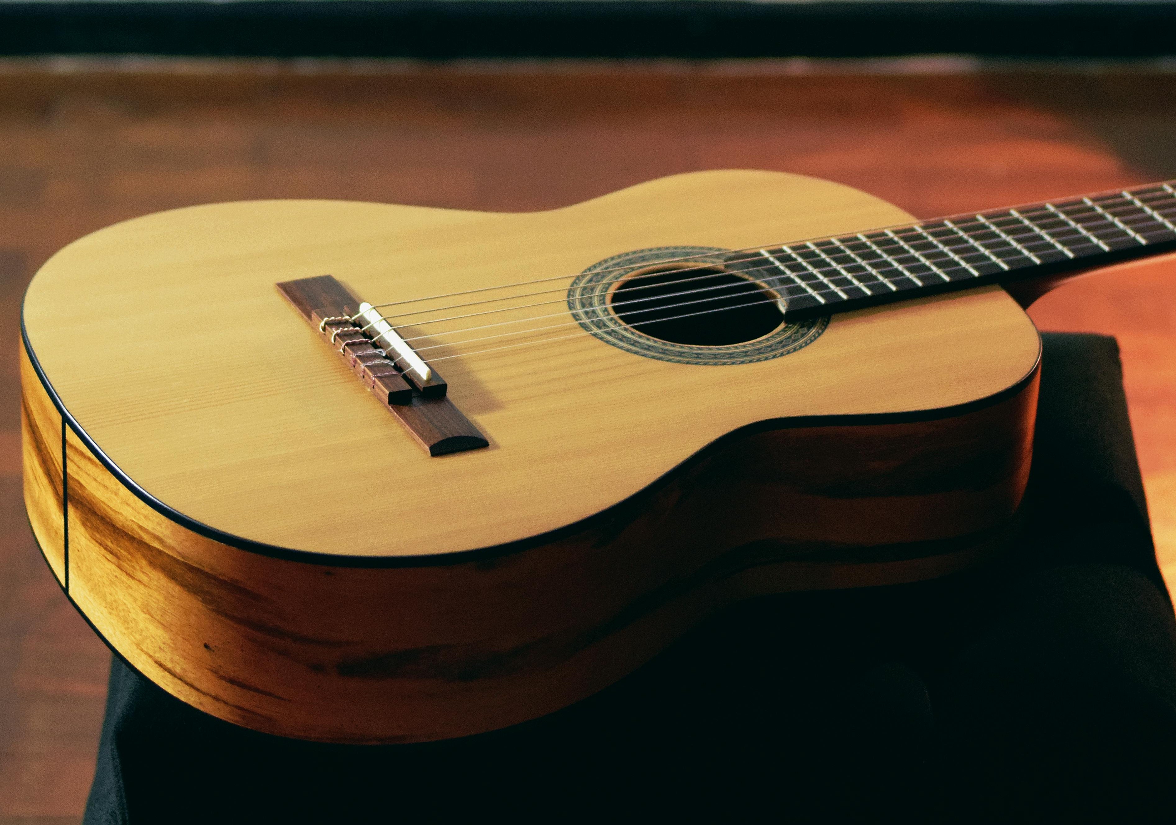 Acoustic guitar close-up representing Henry Winter's live music performances
