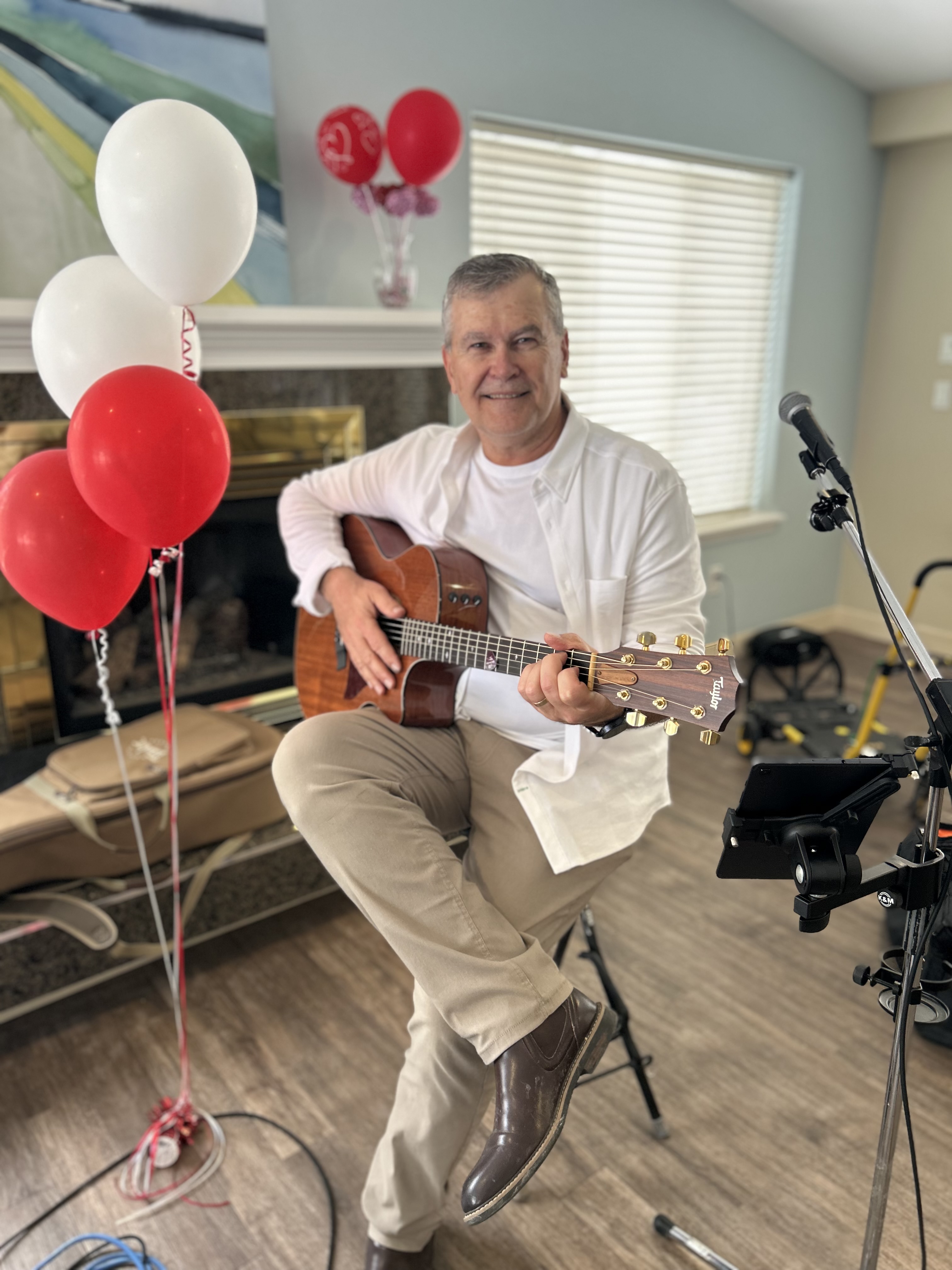Henry Winter, acoustic musician and storyteller, playing guitar in Waterloo Region