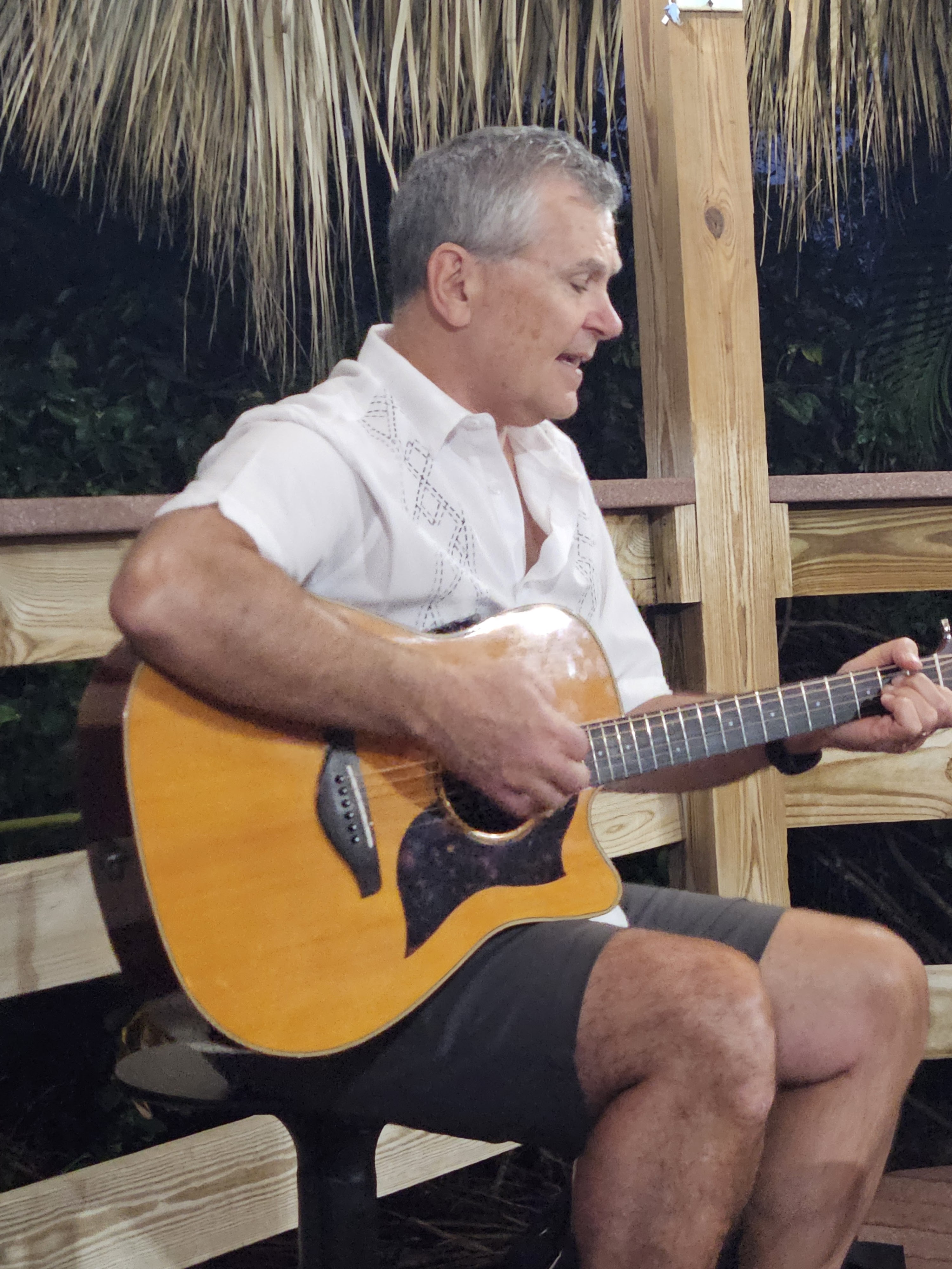 Henry Winter performing live acoustic music at a senior living venue